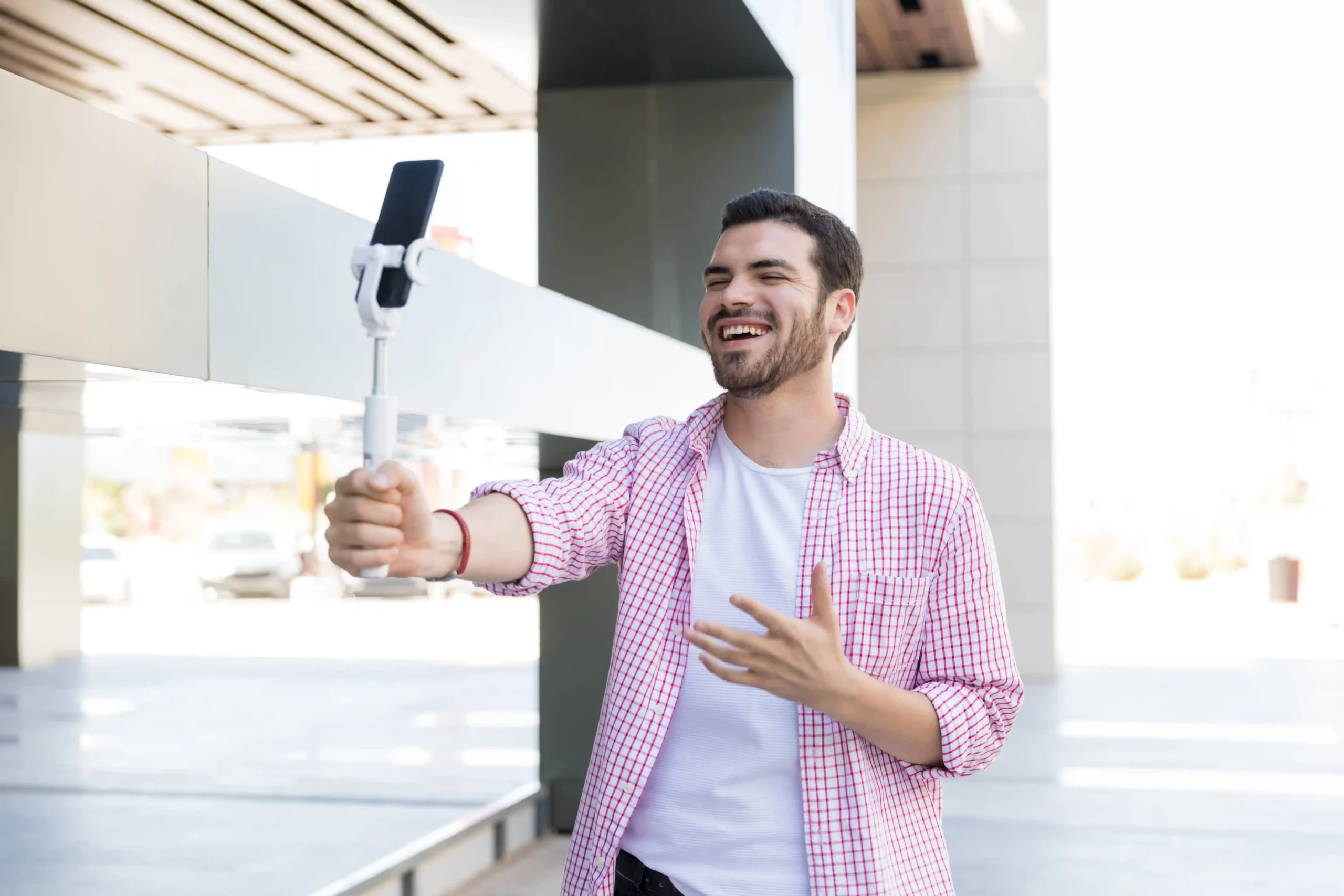 happy-blogger-recording-live-video-smartphone-shopping-mall